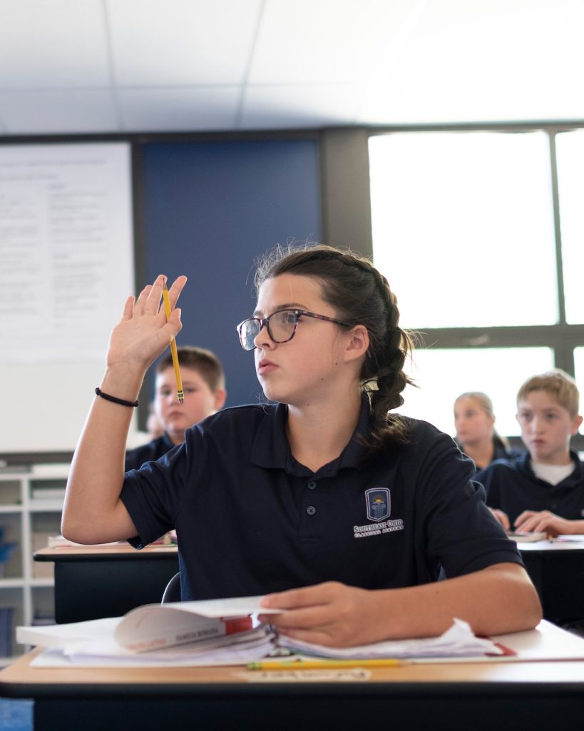 Female student raising her hand
